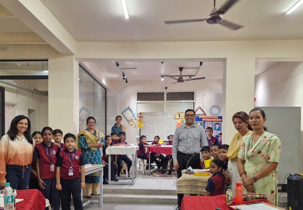 Bright, airy preschool classroom with colorful learning materials on white walls and natural wooden furniture