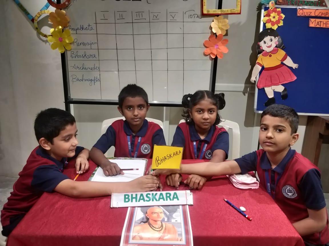 Children engaged in creative art activity at a well-lit preschool table with colorful supplies